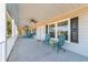 Covered front porch with ceiling fans and seating area at 166 Harvest Moon Dr., Longs, SC 29568