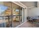 Private screened balcony with patio furniture, offering a relaxing outdoor space at 1891 Colony Dr. # 13D, Surfside Beach, SC 29575
