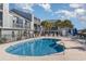Inviting kidney-shaped swimming pool with ample deck space for lounging at 1891 Colony Dr. # 13D, Surfside Beach, SC 29575