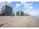 Wide sandy beach with oceanfront high-rise buildings at 2501 S Ocean Blvd. # 1219, Myrtle Beach, SC 29577