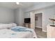 Guest bedroom with twin beds, TV, and access to bathroom at 2501 S Ocean Blvd. # 1219, Myrtle Beach, SC 29577