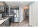 Modern kitchen with stainless steel appliances and gray cabinets at 2501 S Ocean Blvd. # 1219, Myrtle Beach, SC 29577