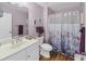 Light and bright bathroom with floral shower curtain at 260 S Crow Creek Dr. # 18, Calabash, NC 28467