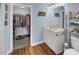 Bathroom with walk-in closet, single vanity, and shower at 260 S Crow Creek Dr. # 18, Calabash, NC 28467