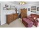 Bedroom featuring a dresser, armchair, and ottoman at 260 S Crow Creek Dr. # 18, Calabash, NC 28467
