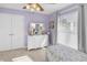 Bedroom with double doors, dresser, and window at 260 S Crow Creek Dr. # 18, Calabash, NC 28467