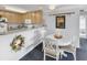 Bright kitchen with light wood cabinets, granite countertops, and breakfast bar at 260 S Crow Creek Dr. # 18, Calabash, NC 28467