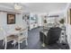 Spacious living room with comfy seating, large TV, and access to a balcony at 260 S Crow Creek Dr. # 18, Calabash, NC 28467