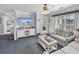 Relaxing living room with light blue walls and access to a balcony at 260 S Crow Creek Dr. # 18, Calabash, NC 28467