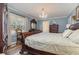 Main bedroom with hardwood floors and elegant furnishings at 2647 Coats Rd., Loris, SC 29569