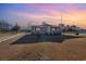 House exterior at sunset, showcasing front porch at 2647 Coats Rd., Loris, SC 29569