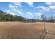 House exterior view with grassy yard and trees at 2647 Coats Rd., Loris, SC 29569