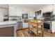 Bright kitchen featuring stainless steel appliances and wood island at 2647 Coats Rd., Loris, SC 29569