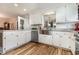 White kitchen with stainless steel appliances and granite counters at 2647 Coats Rd., Loris, SC 29569