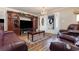 Living room with leather furniture, wood floors, and entertainment center at 2647 Coats Rd., Loris, SC 29569