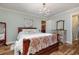 Spacious main bedroom with a large bed and chandelier at 2647 Coats Rd., Loris, SC 29569