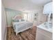 Spacious main bedroom with a king-size bed and hardwood floors at 299 Lake Arrowhead Rd., Myrtle Beach, SC 29572