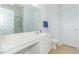 Clean bathroom with a single sink vanity, shower, and tile flooring at 306 River Rock Ln. # 1304, Murrells Inlet, SC 29576