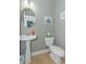 Small bathroom with pedestal sink and toilet at 306 River Rock Ln. # 1304, Murrells Inlet, SC 29576