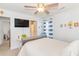 Bright bedroom with a queen bed, TV, and ensuite bathroom at 306 River Rock Ln. # 1304, Murrells Inlet, SC 29576