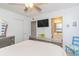Bedroom with a queen bed, TV, and access to bathroom at 306 River Rock Ln. # 1304, Murrells Inlet, SC 29576