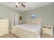 Main bedroom with ceiling fan, large bed, and plenty of dresser space at 306 River Rock Ln. # 1304, Murrells Inlet, SC 29576