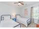 Bedroom with two twin beds, nightstand and ceiling fan at 306 River Rock Ln. # 1304, Murrells Inlet, SC 29576