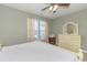 Bedroom with large windows, ceiling fan, and ample closet space at 306 River Rock Ln. # 1304, Murrells Inlet, SC 29576