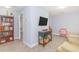 Spacious bonus room with built-in shelving and a comfortable seating area at 306 River Rock Ln. # 1304, Murrells Inlet, SC 29576