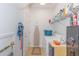 Laundry room with washer, dryer, and storage shelves at 306 River Rock Ln. # 1304, Murrells Inlet, SC 29576