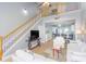 Open living room with a view into the kitchen and a staircase to the upper level at 306 River Rock Ln. # 1304, Murrells Inlet, SC 29576