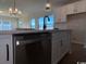 Kitchen island with stainless steel dishwasher and black faucet at 314 Valerio St., Myrtle Beach, SC 29579