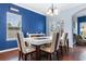 Dining room with hardwood floors and a white table at 3220 Saddlewood Circle, Myrtle Beach, SC 29579