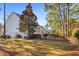 Side view of house with a fenced yard and lush landscaping at 327 Crooked Gulley Circle, Sunset Beach, NC 28468