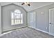 Bright bedroom with carpet flooring, large window, and ceiling fan at 340 William Nobles Rd., Aynor, SC 29511