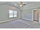 Spacious bedroom with grey carpet and ceiling fan at 340 William Nobles Rd., Aynor, SC 29511