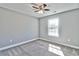 Well-lit bedroom featuring grey walls and carpet flooring at 340 William Nobles Rd., Aynor, SC 29511