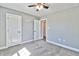 Spacious bedroom with carpet, two doors, and a ceiling fan at 340 William Nobles Rd., Aynor, SC 29511