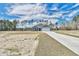 House exterior showcasing a grey exterior and driveway at 340 William Nobles Rd., Aynor, SC 29511