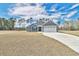 Newly built home with gray siding, two-car garage, and a spacious lawn at 340 William Nobles Rd., Aynor, SC 29511