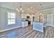 Open kitchen with white cabinets, granite counters, and stainless steel appliances at 340 William Nobles Rd., Aynor, SC 29511