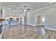 Open living room features hardwood floors, a fireplace, and access to the kitchen at 340 William Nobles Rd., Aynor, SC 29511