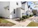 Rear exterior view showing white building, landscaping, and a walkway at 3525 Bristol Ln., Myrtle Beach, SC 29577