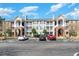 Three-story apartment building with brick and siding, balconies, and ample parking at 3753 Citation Way # 428, Myrtle Beach, SC 29577