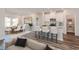 Modern kitchen with island, white cabinets, and adjacent dining area at 4319 Falls Oaks St., Myrtle Beach, SC 29579