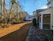 Landscaped backyard with patio and surrounding trees at 437 Red Rose Blvd. # 5, Pawleys Island, SC 29585