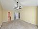 Bright bedroom with ceiling fan and en-suite bathroom access at 437 Red Rose Blvd. # 5, Pawleys Island, SC 29585