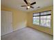 Spacious bedroom with a large window and ceiling fan at 437 Red Rose Blvd. # 5, Pawleys Island, SC 29585