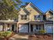 Two-story townhome with a garage and landscaping at 437 Red Rose Blvd. # 5, Pawleys Island, SC 29585