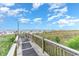 Convenient boardwalk path to the sandy beach at 501 S Ocean Blvd. # 404, North Myrtle Beach, SC 29582